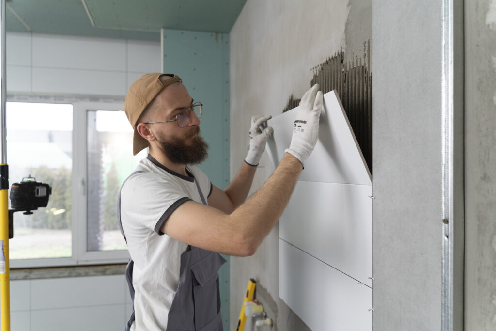 Skilled mason working on construction site in UAE with bricks and cement – legal blue collar job opportunity
